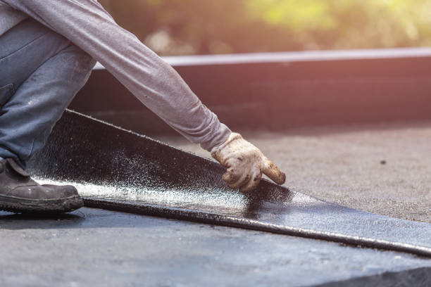 Professional Emergency Waterproofing technician working in Montgomery, MI